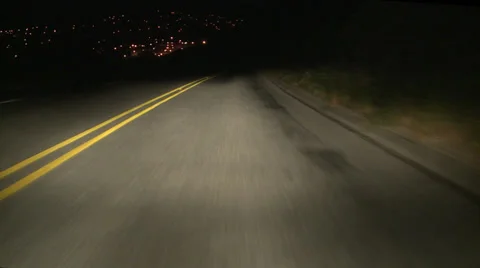 Driving POV night toward city 30p Stock Footage