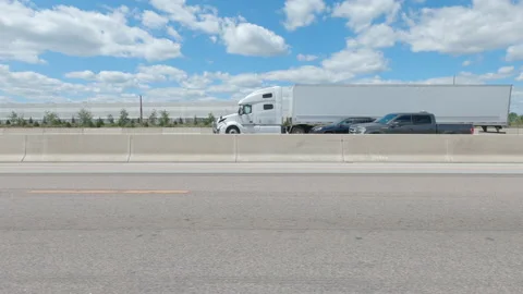Driving  POV side view on highway at high speed with cars and truck traffic Stock Footage 158310473