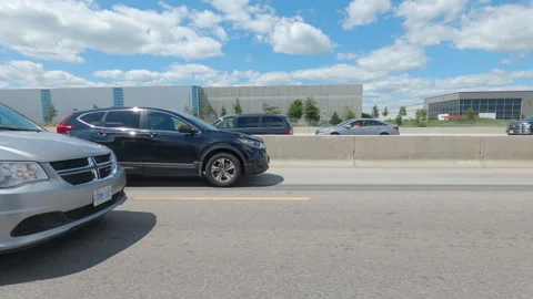 Driving  POV side view on highway at high speed with cars and truck traffic Stock Footage 158311472