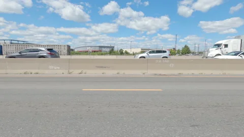 Driving  POV side view on highway at high speed with cars and truck traffic Stock Footage 158312483