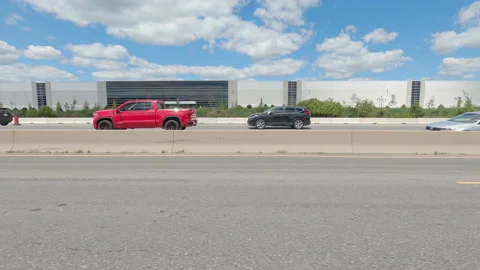 Driving  POV side view on highway at high speed with cars and truck traffic Stock Footage 158316248
