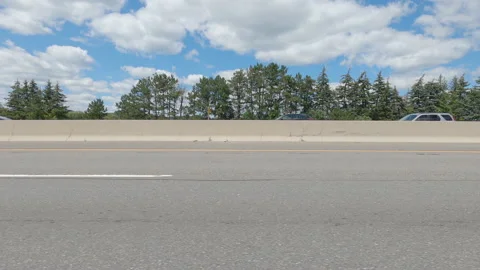 Driving  POV side view on highway at high speed with cars and truck traffic Stock Footage 158317203