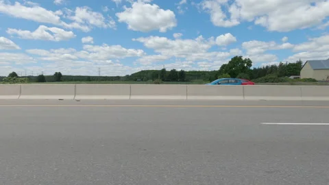 Driving  POV side view on highway at high speed with cars and truck traffic Stock Footage 158319770
