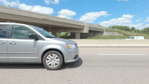 Driving  POV side view on highway at high speed with cars and truck traffic Stock Footage 158329748