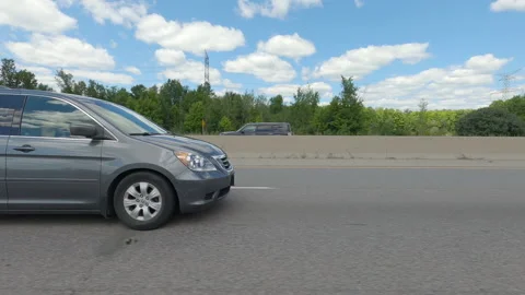 Driving  POV side view on highway at high speed with cars and truck traffic Stock Footage 158331014