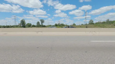 Driving  POV side view on highway at high speed with cars and truck traffic Stock Footage 158332203