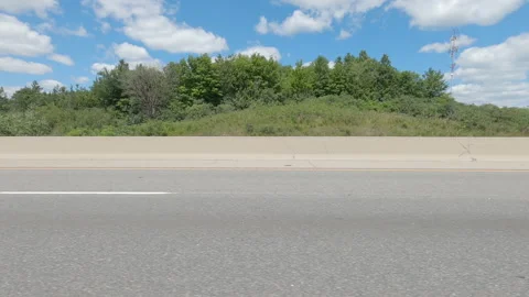 Driving  POV side view on highway at high speed with cars and truck traffic Stock Footage 158332873