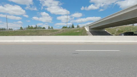 Driving  POV side view on highway at high speed with cars and truck traffic Stock Footage 158333603