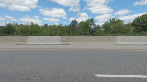 Driving  POV side view on highway at high speed with cars and truck traffic Stock Footage 158334147