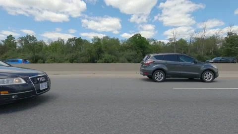Driving  POV side view on highway at high speed with cars and truck traffic Stock Footage 158334692