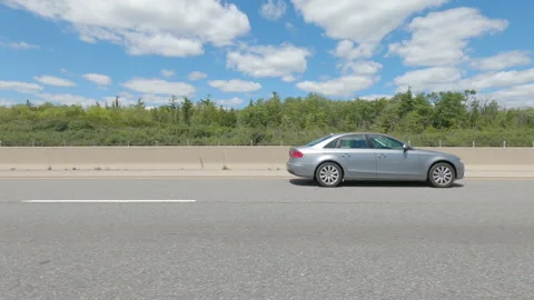 Driving  POV side view on highway at high speed with cars and truck traffic Stock Footage 158335288