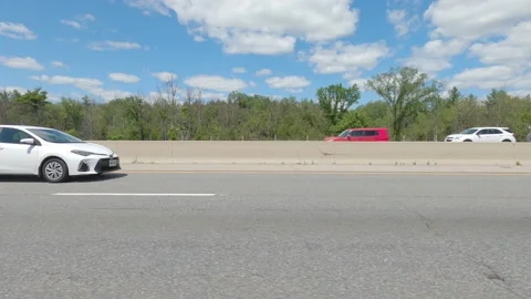 Driving  POV side view on highway at high speed with cars and truck traffic Stock Footage 158336005