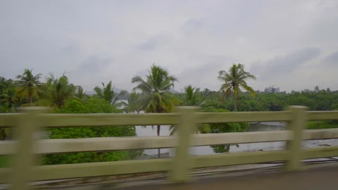 Driving pov view through an old bridge made with wooden handrail in cochin india Stock Footage 106510585