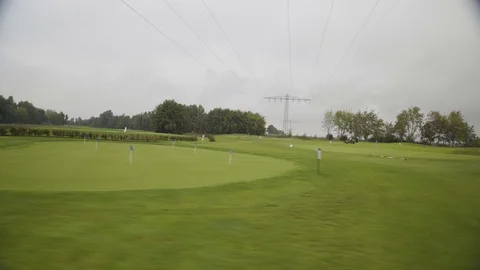Driving by putting green Stock Footage 104853089