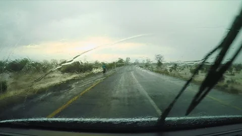Driving in the rain in Africa Stock Footage 74419600