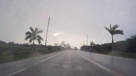 Driving In The Rain - Antigua Stock Footage 104842664