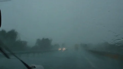 Driving in rain hurricane storm rain drops wind screen wiper Stockbeeldmateriaal 101500651