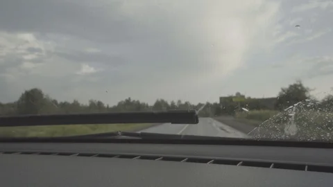 Driving in the rain. Inside car with rain drops on car windshield. Stock Footage 115859584