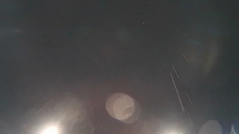 Driving in the rain in LA, looking up into the rain. Stockbeeldmateriaal 99609221