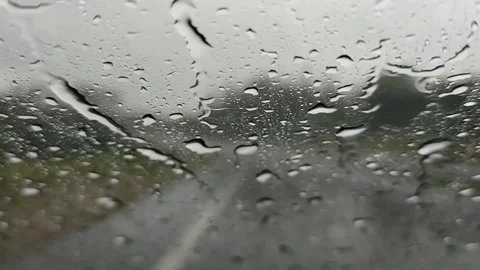 Driving in Rain: Windscreen View of Raindrops Stock Footage 310498242