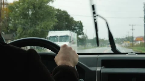 Driving in rainy weather with windshield wipers working to clear view of ro.. Stock Footage 334593000