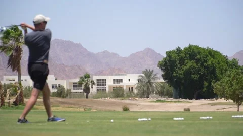Driving Range Golf. Man practicing with golf club. Slow motion Video stock 194579399