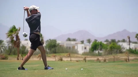 Driving Range Golf. Man practicing with golf club. Slow motion Vidéo 224359760