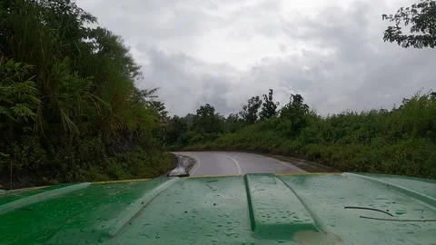 Driving range rover on a hilly road with rain  Stock Footage 273635782