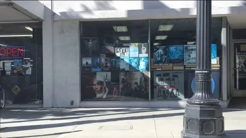 Driving + Record Store Exterior Video stock 81164569