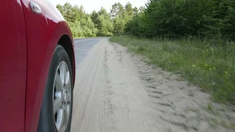 Driving a red car over the road along the asphalt at speed, view from the wheel. Stock Footage 135988588