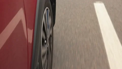 Driving a red car over the road along the asphalt at speed Stock Footage 223540221