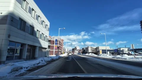 Driving to red light past intersection in Hakodate winter city street Video stock 333069383