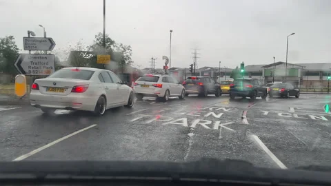 Driving Redclyffe roundabout on M60 motorway at Junction 10 in rain. Stock Footage 258763207