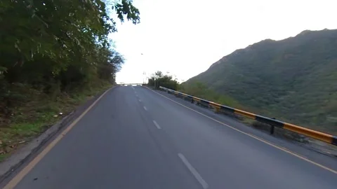 Driving on Road aside of Mountain Stock Footage 173187046