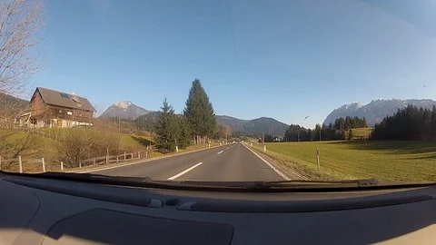 Driving on a road in the austrian alps Видео 127040370