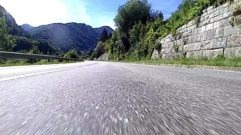 Driving on a road in the austrian alps Stock Footage 135367176