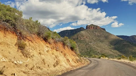 Driving on the road between the mountains of Tonto National Park Stock Footage 213510716