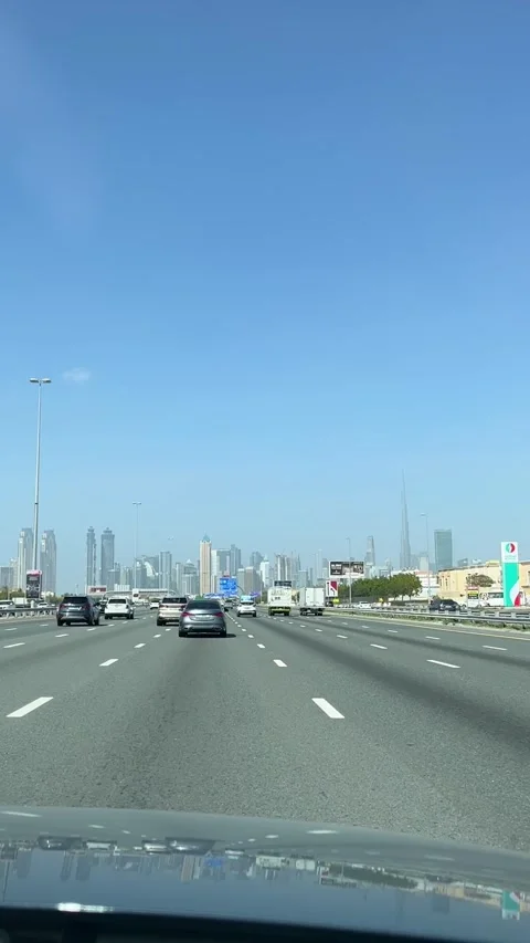 Driving on a road with Downtown Dubai in the background, view from the car Stock Footage 311200254