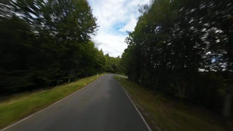Driving road in the hills in the eiffel Germany. FPV flying drone Stock Footage 287447514