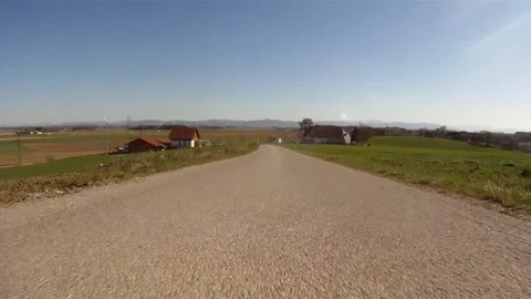 Driving on a road with low traffic in the austrian countryside 库存影片 127985939