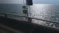 Driving on road near the blue sea, travelling on coastline, calm water surface HD Footage
