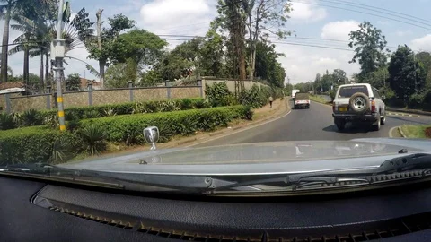 Driving on a road in a nice developed area of Africa Video stock 107173731