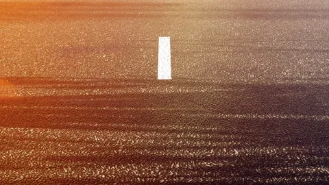 Driving by the road at sunset. Seamless looping Stock Footage 164536725