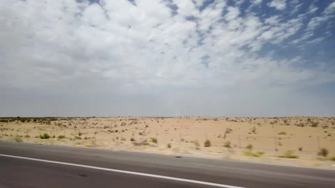 Driving on road through Karakum Desert landscape, Turkmenistan, Central Asia Stock Footage 320589503