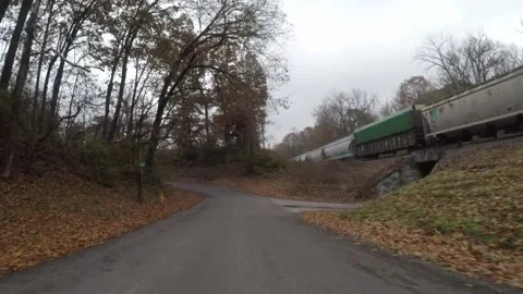 Driving on a road by train tracks Stock Footage 130821554