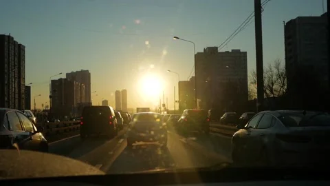 Driving on road trip at sunset. Driving car towards bright scenery sun Stock Footage 144555464