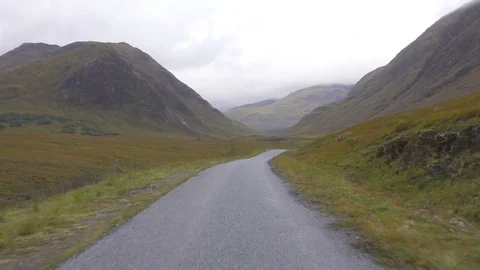 Driving on a road in Wild Glen Etive Valley in Scotland Stock-Footage 82550102