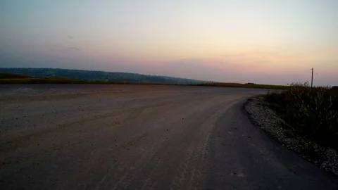 Driving rough paved road with camera at low angle. Stock Footage 82794306