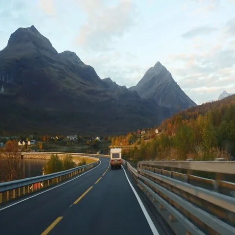 Driving on route E8 toward the city of Tromso, on a nice evening sunset, in n Stock Footage 69469273