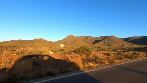 Driving on a rural road next to shadow of car Stock Footage 118259596